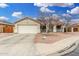 Charming single-story home featuring a two-car garage and desert landscaping for low maintenance at 13308 W Acapulco Ln, Surprise, AZ 85379