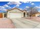 Charming single-story home featuring a two-car garage and desert landscaping for low maintenance at 13308 W Acapulco Ln, Surprise, AZ 85379