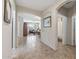 Hallway with an archway leading to a living area, creating a seamless transition between rooms at 13545 W Caribbean Ln, Surprise, AZ 85379