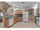 Bright kitchen with appliances, plenty of cabinets and tile floors at 13545 W Caribbean Ln, Surprise, AZ 85379