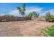 Wide backyard featuring a covered patio, mature trees, and a large playground at 1361 W Roosevelt Ave, Coolidge, AZ 85128