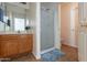 Bathroom features include a shower, single sink vanity, and neutral tile flooring at 1361 W Roosevelt Ave, Coolidge, AZ 85128