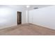 Spacious carpeted bedroom with an en-suite bathroom and a closet door visible at 1361 W Roosevelt Ave, Coolidge, AZ 85128