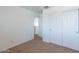 Bedroom featuring neutral carpet, and closet with sliding doors at 1361 W Roosevelt Ave, Coolidge, AZ 85128