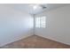 Comfortable bedroom featuring a window and neutral carpeting at 1361 W Roosevelt Ave, Coolidge, AZ 85128