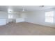 Open bonus room with plush carpeting and natural lighting at 1361 W Roosevelt Ave, Coolidge, AZ 85128