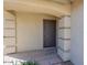 Close-up view of the front entrance featuring a contemporary-style dark wood door at 1361 W Roosevelt Ave, Coolidge, AZ 85128