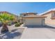 Inviting two-story home boasting a well-maintained lawn and attached two-car garage at 1361 W Roosevelt Ave, Coolidge, AZ 85128