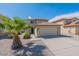 Inviting two-story home boasting a well-maintained lawn and attached two-car garage at 1361 W Roosevelt Ave, Coolidge, AZ 85128