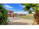 Backyard showcasing a pergola, manicured lawn, desert landscaping, and privacy wall at 13834 N 39Th Ln, Phoenix, AZ 85053