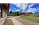 Spacious backyard featuring a pergola, green grass, gravel, walkway and block fence at 13834 N 39Th Ln, Phoenix, AZ 85053