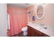 Bathroom boasts a vanity, tiled flooring, a decorative mirror and updated fixtures at 13834 N 39Th Ln, Phoenix, AZ 85053