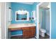 Brightly-colored bathroom with integrated vanity, spacious cabinet, and mirror, adjacent to separate toilet and shower at 13834 N 39Th Ln, Phoenix, AZ 85053