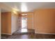 Open foyer area with tile flooring and a view through the double doors to the covered entry at 13834 N 39Th Ln, Phoenix, AZ 85053