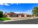 Street view of a single-story home with desert landscaping and solar panels on the roof at 13834 N 39Th Ln, Phoenix, AZ 85053