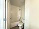 Bright bathroom with a shower-tub combo and tile flooring, creating a clean and functional space at 1492 S 218Th Ln, Buckeye, AZ 85326