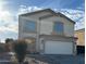 Charming two-story home featuring a two-car garage and low maintenance desert landscaping at 1492 S 218Th Ln, Buckeye, AZ 85326