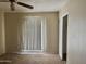 Bedroom with a neutral color palette, ceiling fan and closet at 1512 N Iowa St, Chandler, AZ 85225