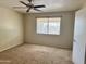 Bedroom with a neutral color palette, ceiling fan and one window at 1512 N Iowa St, Chandler, AZ 85225