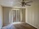 This bedroom has neutral paint, carpet, and a ceiling fan at 1512 N Iowa St, Chandler, AZ 85225