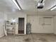 Garage interior with water heater, pegboard, and storage shelf at 1512 N Iowa St, Chandler, AZ 85225