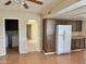 Spacious kitchen featuring wood cabinets and white appliances at 1512 N Iowa St, Chandler, AZ 85225