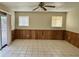 Open living room featuring laminate floors and access to the back yard at 1512 N Iowa St, Chandler, AZ 85225