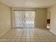 Bright living room featuring neutral walls, tile flooring, and natural light at 1512 N Iowa St, Chandler, AZ 85225