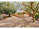 A backyard showcasing desert landscaping and the rear exterior of the home at 17218 W Mahogany Way, Surprise, AZ 85387