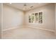 Bedroom featuring a large window with white shutters and plush carpeting at 17218 W Mahogany Way, Surprise, AZ 85387