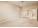 Bedroom with plush carpet and large sliding closet, with a partial bathroom view at 17218 W Mahogany Way, Surprise, AZ 85387