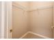 Walk-in closet with carpeted flooring, wire shelving, and neutral colored walls at 17218 W Mahogany Way, Surprise, AZ 85387