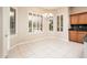 Bright dining area with a chandelier and multiple windows at 17218 W Mahogany Way, Surprise, AZ 85387