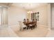 Bright dining area with a chandelier, shuttered windows, and space for a large table at 17218 W Mahogany Way, Surprise, AZ 85387