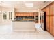 Kitchen featuring stainless steel appliances, green granite countertops, and a center island at 17218 W Mahogany Way, Surprise, AZ 85387