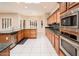 Eat-in kitchen featuring stainless steel appliances and green granite countertops at 17218 W Mahogany Way, Surprise, AZ 85387