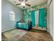 Bright bedroom with blue accents, a bed, and wood-look flooring at 17346 W Lincoln St, Goodyear, AZ 85338