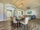 Open dining room with ceiling fan, decorative lighting, and views to living spaces at 17346 W Lincoln St, Goodyear, AZ 85338