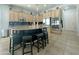 Spacious kitchen featuring an island with seating, stainless steel appliances, and granite countertops at 17346 W Lincoln St, Goodyear, AZ 85338