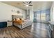 Inviting main bedroom featuring wood-look floors and plenty of natural light at 17346 W Lincoln St, Goodyear, AZ 85338