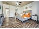 Spacious main bedroom with wood-look flooring and neutral decor at 17346 W Lincoln St, Goodyear, AZ 85338