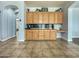 Convenient pantry with sliding barn doors, offering ample storage and organization space in the kitchen area at 17346 W Lincoln St, Goodyear, AZ 85338