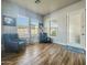 Charming sitting room with natural light, wood-look floors and modern accents at 17346 W Lincoln St, Goodyear, AZ 85338