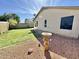 Backyard with well-maintained grass and an interesting birdbath at 18151 N 88Th Dr, Peoria, AZ 85382