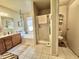 Well-lit bathroom with a separate shower, bathtub and toilet at 18151 N 88Th Dr, Peoria, AZ 85382