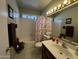 Bathroom with a shower-tub combo and a classic vanity at 18151 N 88Th Dr, Peoria, AZ 85382