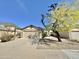 Single-story home featuring a desert landscape, a covered entry, and a two-car garage at 18151 N 88Th Dr, Peoria, AZ 85382