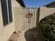 View of a gate to the side yard of the property, offering both privacy and functionality at 18151 N 88Th Dr, Peoria, AZ 85382