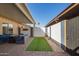 Cozy covered patio area with elegant blue seating, overlooking the charming backyard space at 2112 E Minton Dr, Tempe, AZ 85282