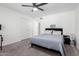 A bedroom featuring a ceiling fan, closet, and soft gray carpet at 2112 E Minton Dr, Tempe, AZ 85282